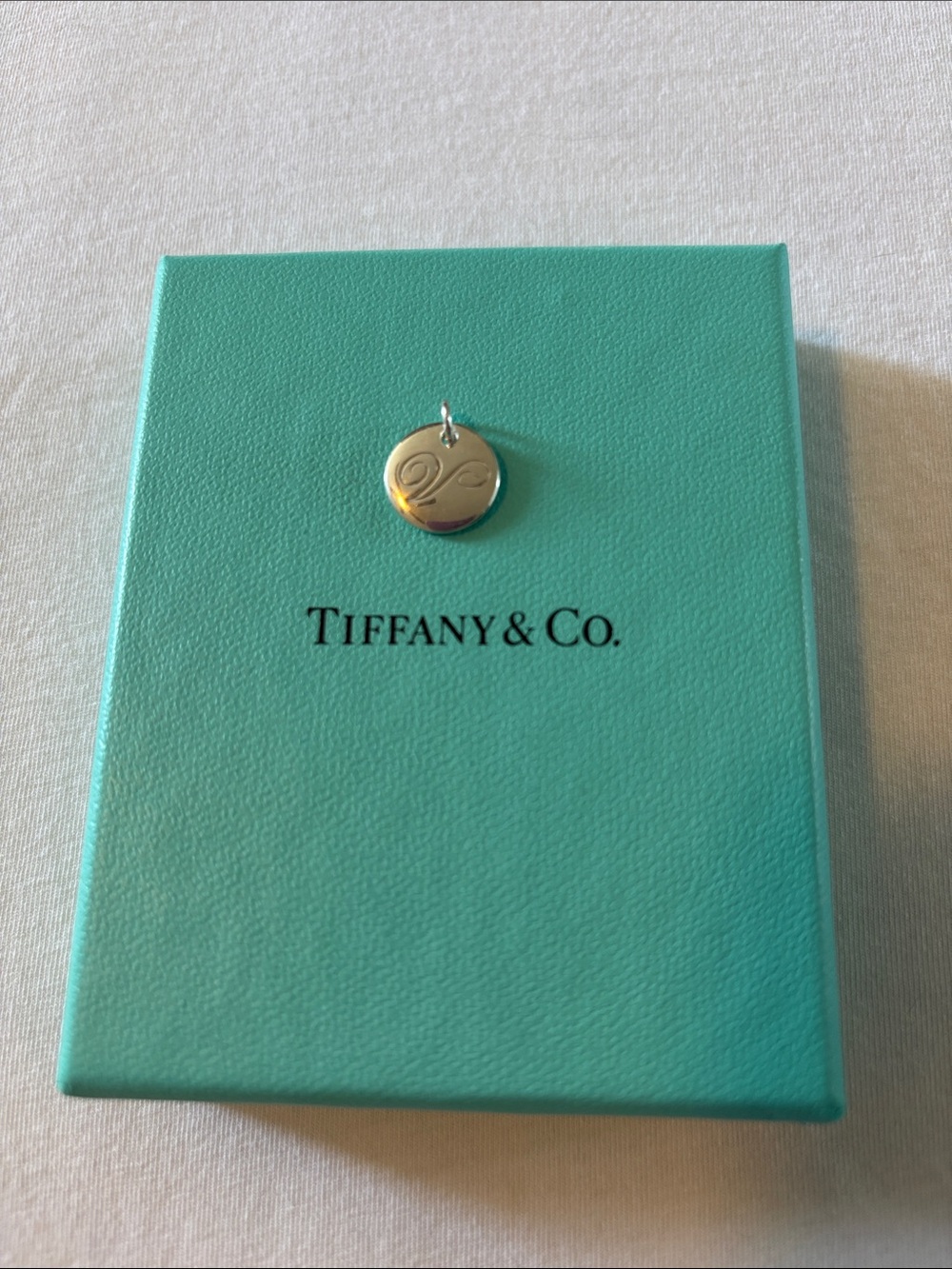 Tiffany & Co. Silver Round Initial V Charm on Signature Blue Box